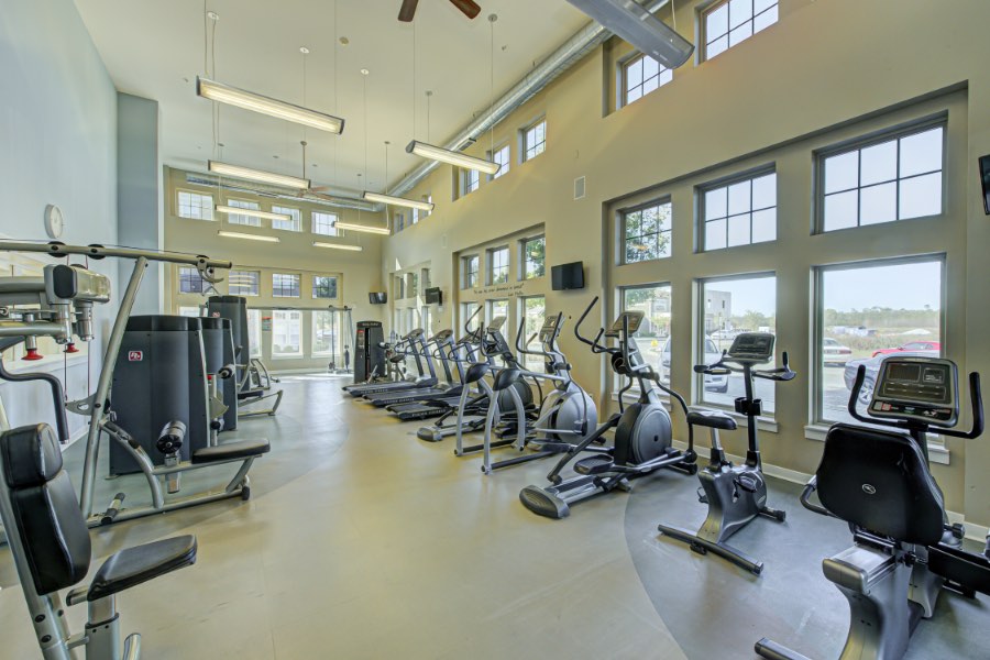 Tell your apartment locator if you want specific amenities like this well-equipped fitness center at The Legacy Towns and Flats. Apartment fitness center with aerobic and strength training equipment.
