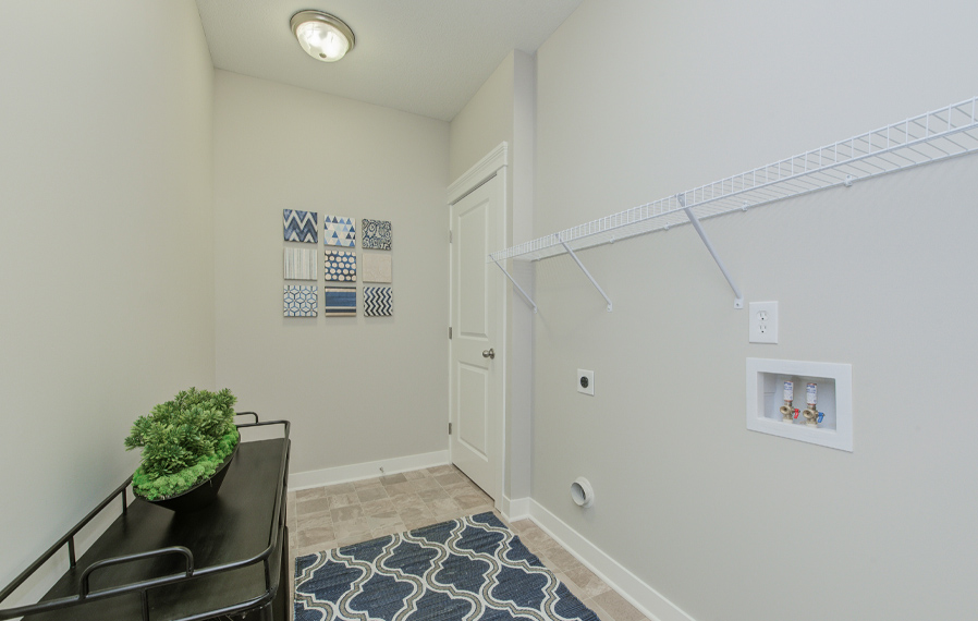 Model laundry room at Highpointe on Meridian Apartments. Model laundry room