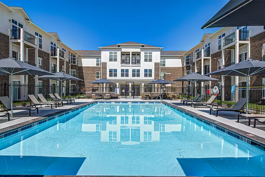 Not sure what a community means by amenities? This pool at Continuum Apartments is one example of an amenity. Pristine pool surrounded by apartment buildings at Continuum Apartments.